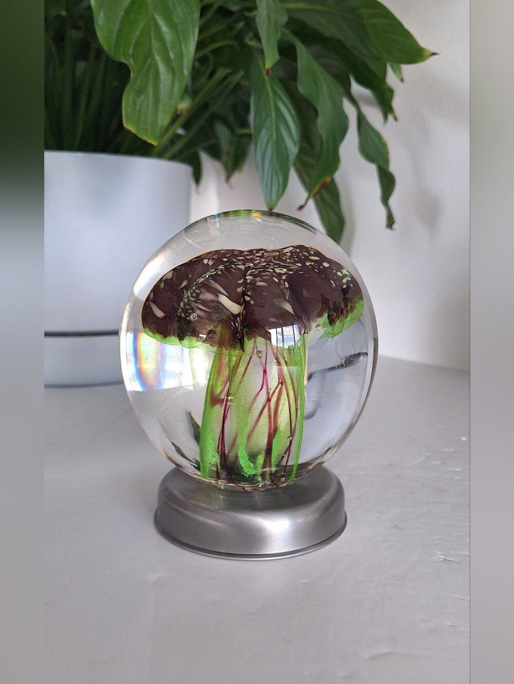 Large glass art sphere with a jellyfish